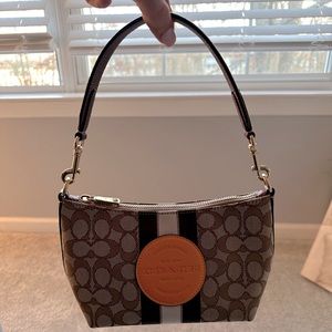 Brand New, Never Used, Cute little Brown and Orange Coach Purse.
